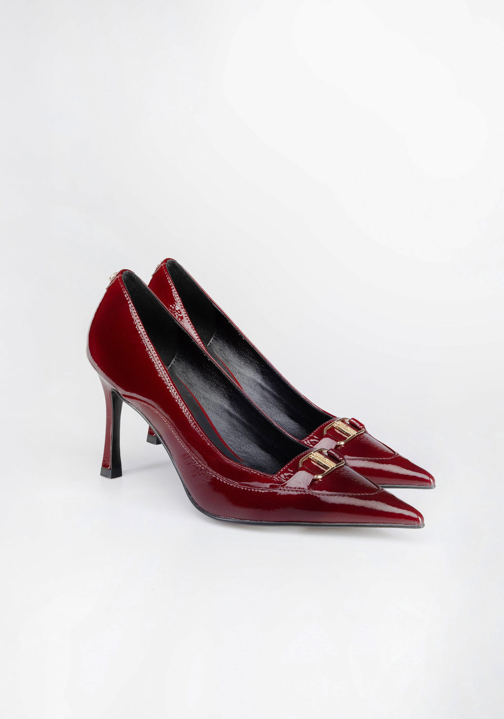 Pointed-Toe Patent Pumps with High Heel and Iconic Buckle