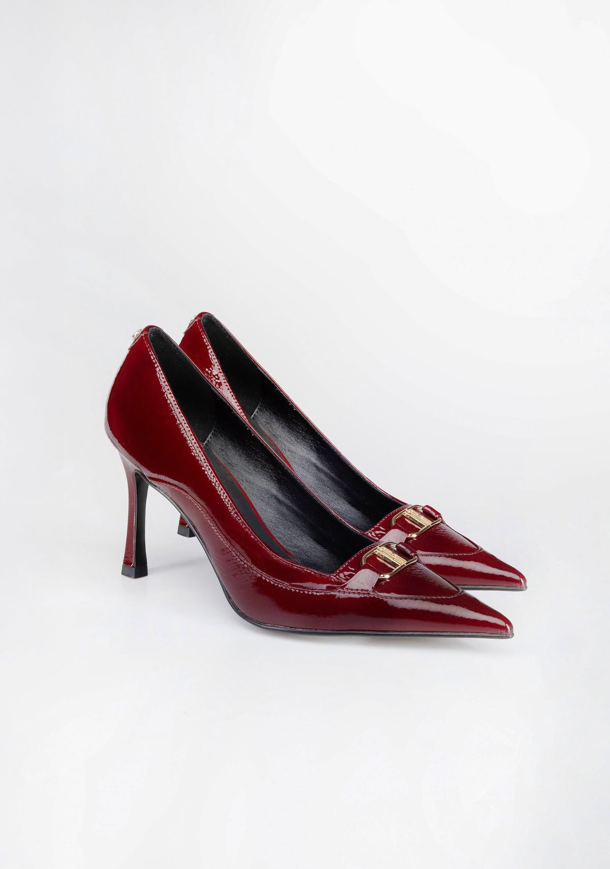 Pointed-Toe Patent Pumps with High Heel and Iconic Buckle