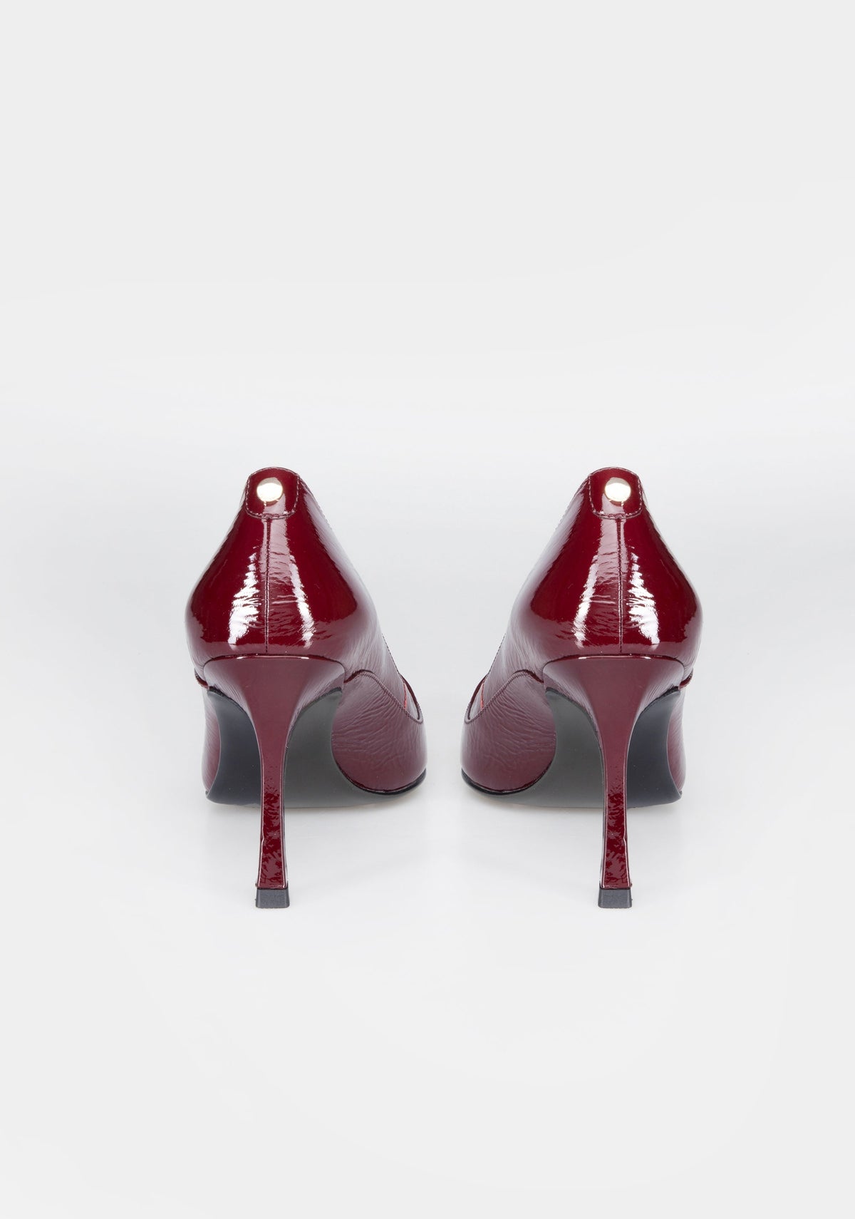 Pointed-Toe Patent Pumps with High Heel and Iconic Buckle